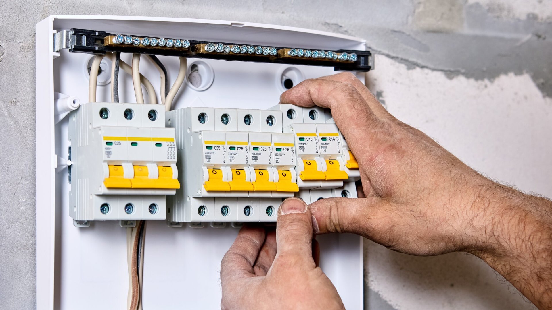 Electrician working on consumer unit