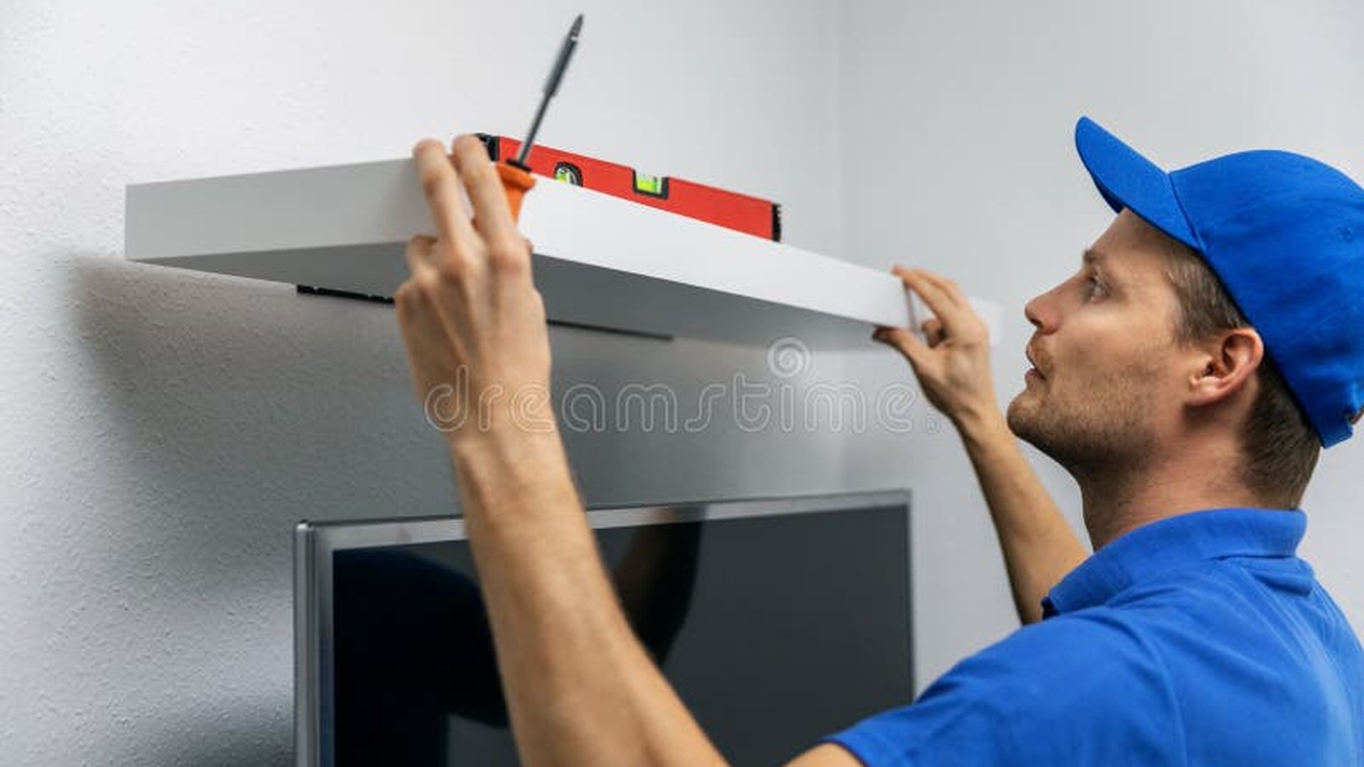 Handyman installing shelves