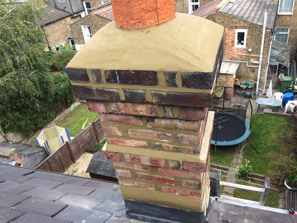 Chimney stack rebuilt and repointed with fresh flaunching