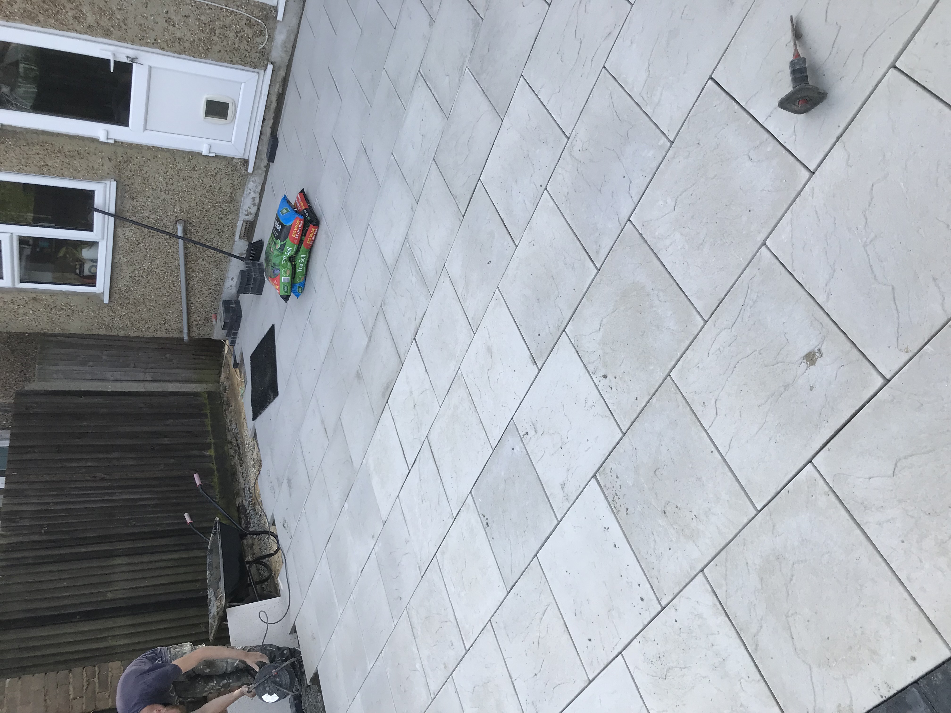 Laying a new porcelain paving patio in a rear garden