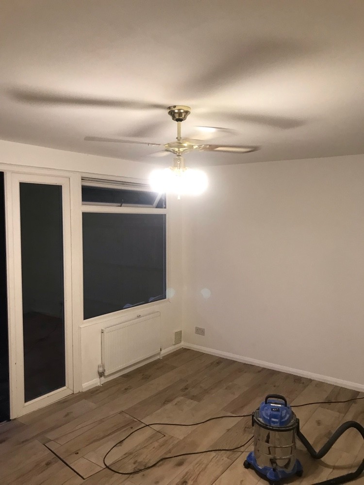 Renovated room with new flooring, decoration and lighting