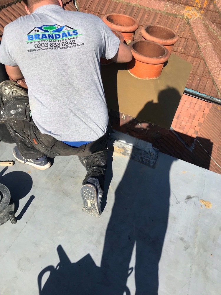 Chimney flaunching and flat roof repair in progress