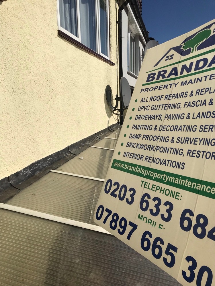 Flat roof works with Brandals company signage on site