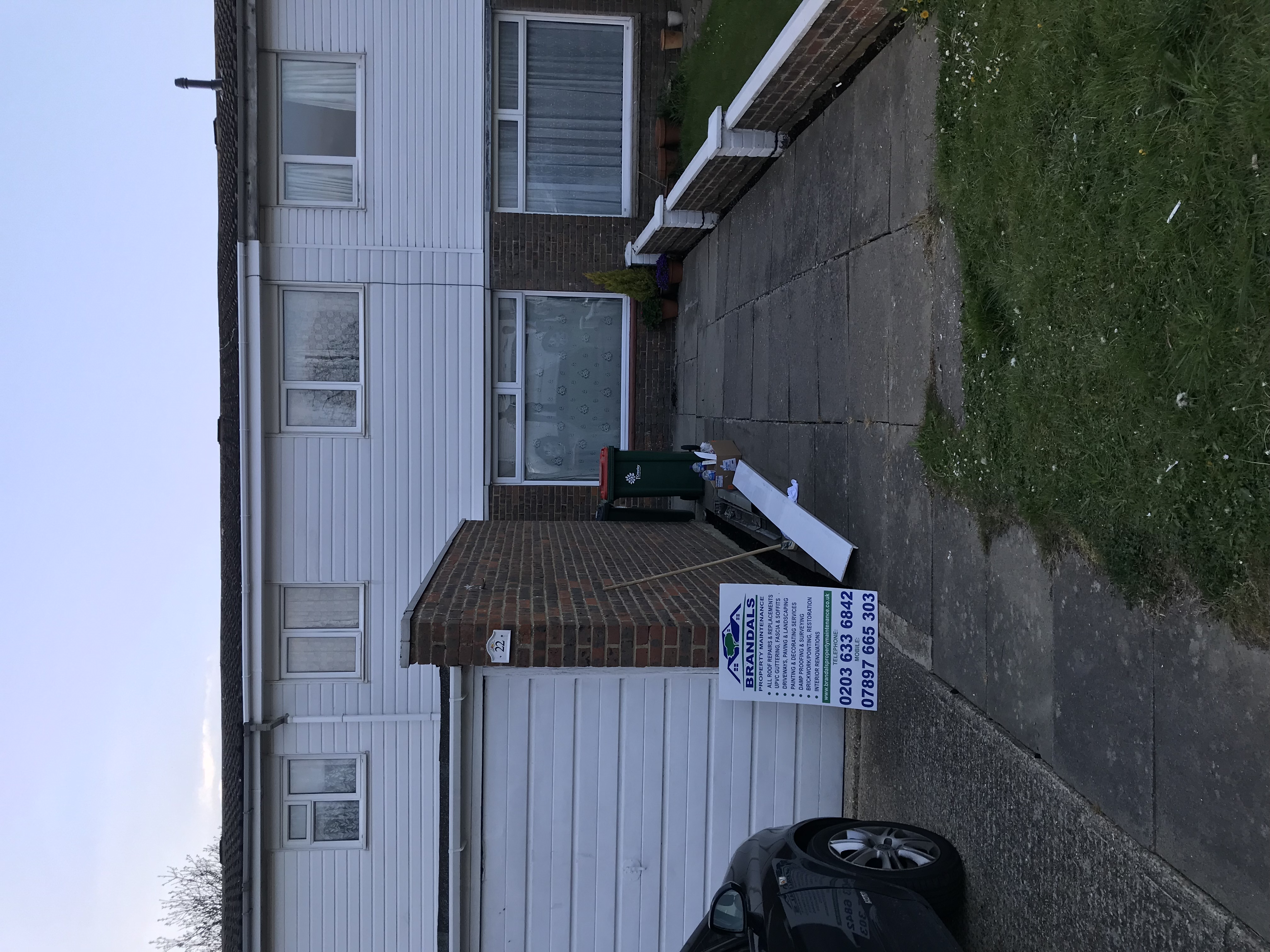 Materials delivered on site with Brandals board outside a home