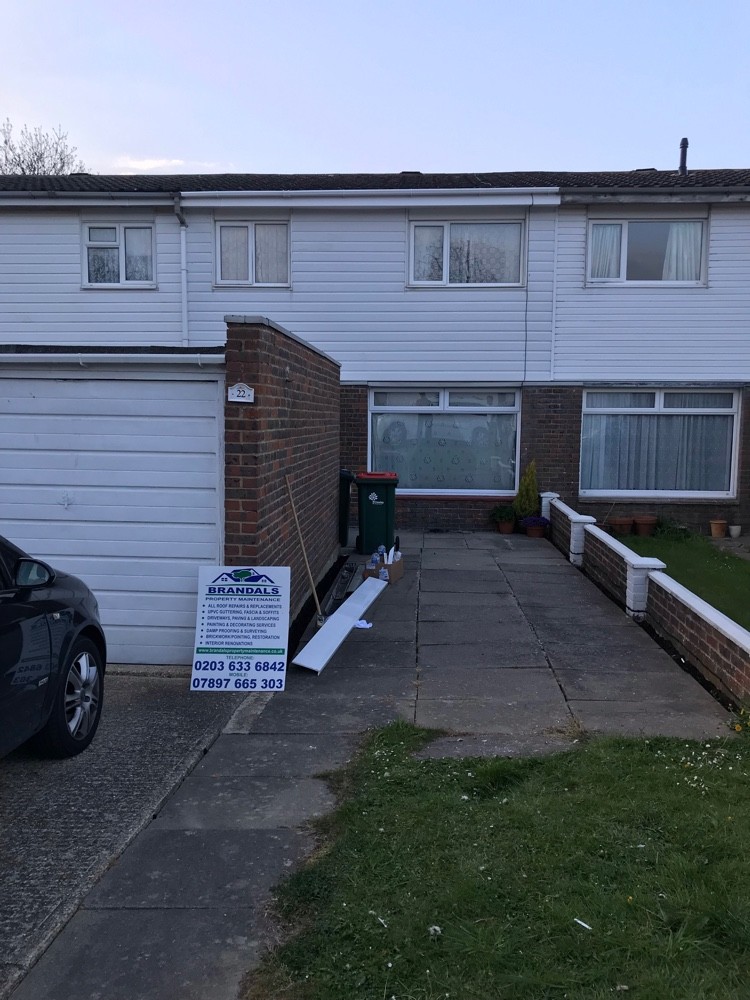 Brandals site board outside a London home during roofing works