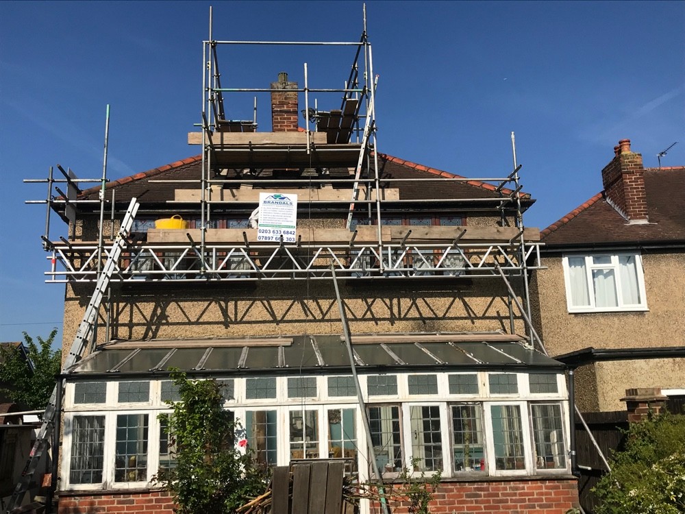 Full scaffold erected for roof and chimney works on a London home