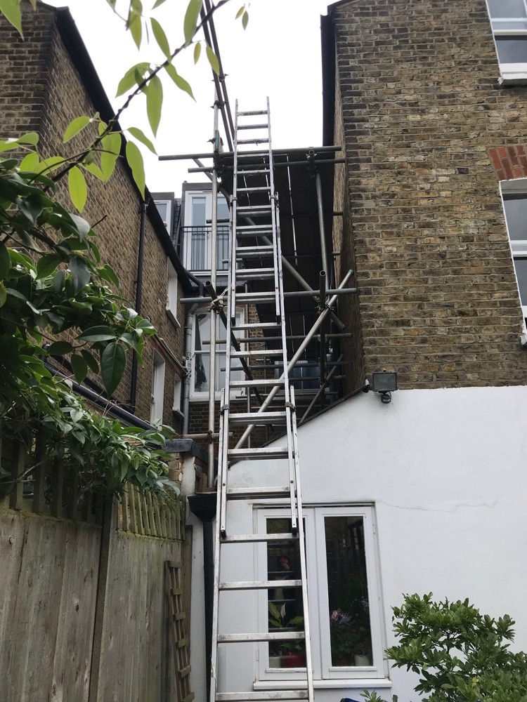 Scaffold and ladder access to rear of London terrace roof