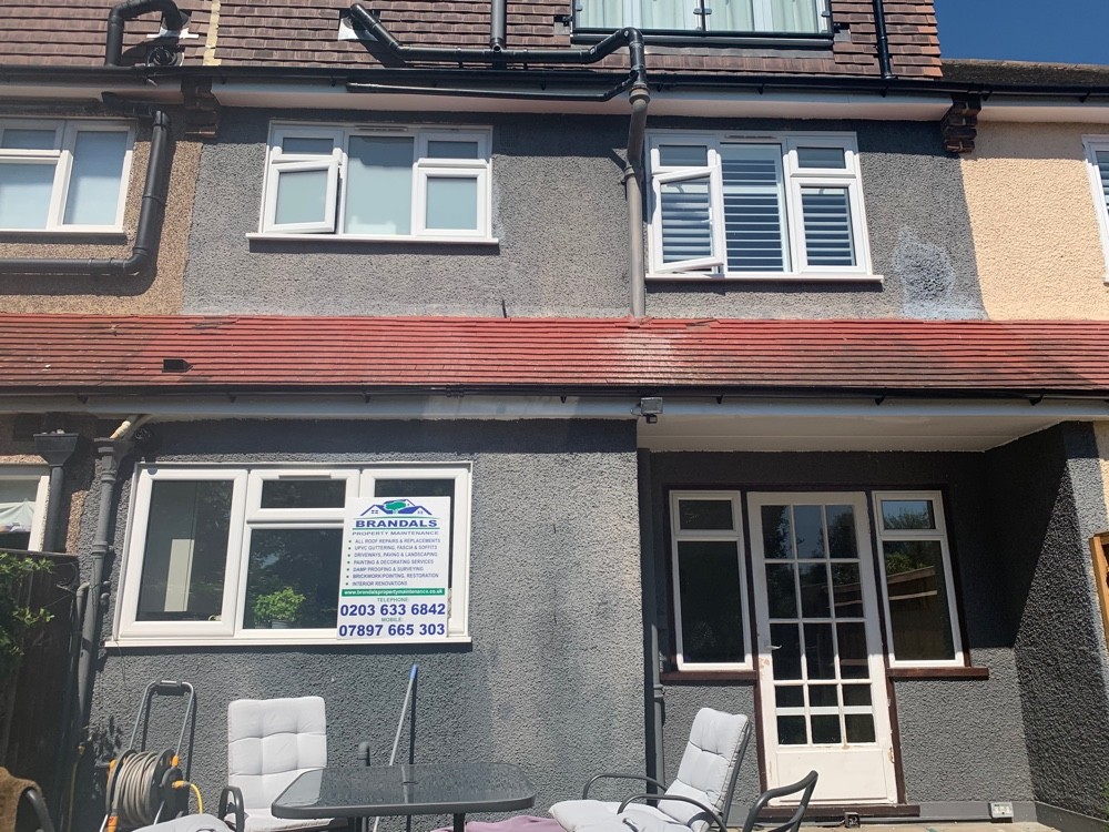 Rebuilt tiled canopy over a rendered rear elevation, Brandals sign displayed