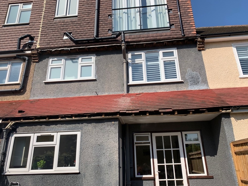 Tiled canopy and rendered terrace after roofing works